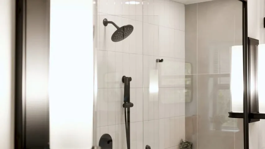 Modern walk-in shower with a glass enclosure, a rain showerhead and black fixtures